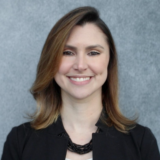 A smiling woman in a black jacket.